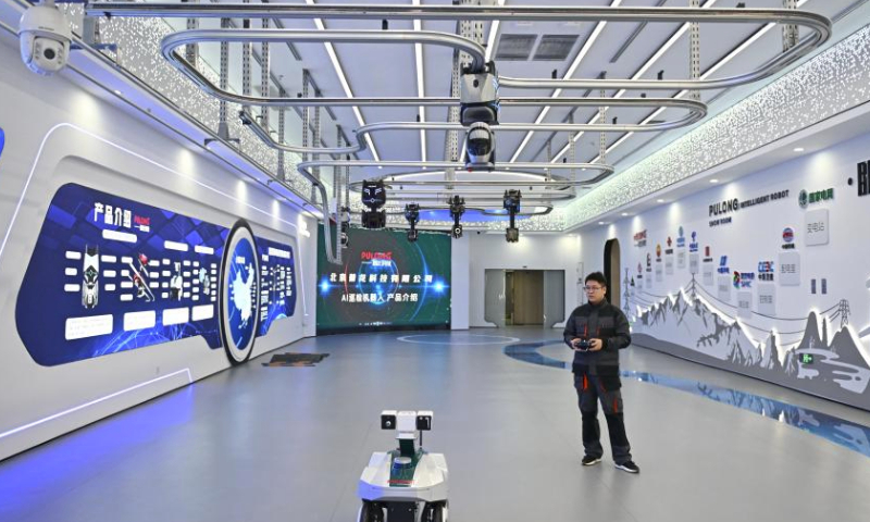 A staff member displays an inspection robot at a test base in the Xiong'an Science and Technology Innovation Center in Xiong'an New Area, north China's Hebei Province, March 28, 2024. In April 2017, China announced a plan to establish the Xiong'an New Area, which spans the Rongcheng, Anxin and Xiongxian counties, as well as some adjacent areas in north China's Hebei Province.

The new area aims to relieve Beijing of non-essential functions related to its status as the nation's capital, while also advancing the coordinated development of the Beijing-Tianjin-Hebei region.

The country has also vowed to build Xiong'an, dubbed the city of the future, into an innovative, green, smart and world-class city with blue skies, fresh air and clean water, in line with the country's high-quality development path. (Xinhua/Mu Yu)