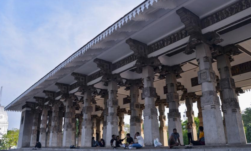 People rest at the Independence Memorial Hall in Colombo, capital of Sri Lanka, March 29, 2024. (Xinhua/Xu Qin)