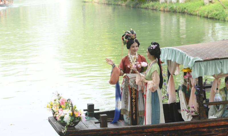 Performers in traditional costumes take a boat parade during the Huazhao Festival celebrations in Xixi Wetland in Hangzhou, east China's Zhejiang Province, March 24, 2024. The annual Huazhao Festival featuring a series of activities, including a boat parade and a folk ritual, was celebrated in Xixi Wetland on Sunday. (Xinhua/Weng Xinyang)