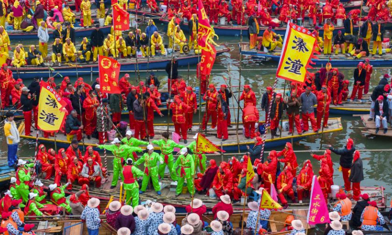An aerial drone photo taken on April 6, 2024 shows people participating in a boat performance during the 2024 Qintong Boat Festival held at Qinhu National Wetland Park in Jiangyan District of Taizhou, east China's Jiangsu Province. Hundreds of boats with more than 10,000 boat team members aboard gathered here on Saturday for the Qintong Boat Festival, which has been a centuries-old tradition. (Photo by Tang Dehong/Xinhua)