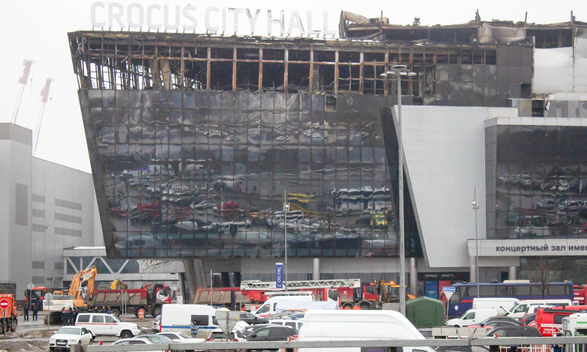 Firefighters and workers demolish the damaged structures of the Crocus City Hall building, which was destroyed by fire in the aftermath of a terrorist attack at the concert venue inside the hall in Moscow, Russia, on March 22, 2024. Photo: VCG 