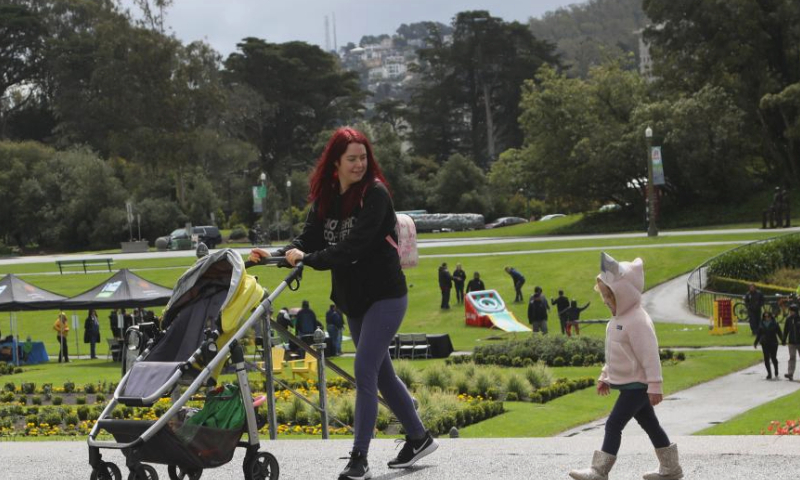 People enjoy themselves at Golden Gate Park in San Francisco, California, the United States, April 4, 2024. Golden Gate Park marked its 154th anniversary on Thursday. (Photo by Liu Yilin/Xinhua)