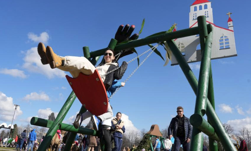 People enjoy themselves during the swing festival in Sigulda, Latvia, March 30, 2024. (Photo by Edijs Palens/Xinhua)