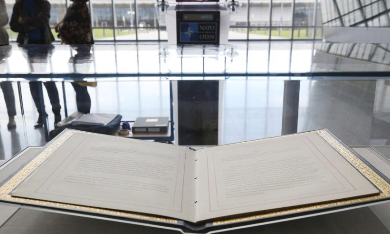 This photo taken on April 4, 2024 shows the original copy of the North Atlantic Treaty displayed at the North Atlantic Treaty Organization (NATO) headquarters in Brussels, Belgium. NATO marked the 75th anniversary since the signing of the North Atlantic Treaty on Thursday. (Xinhua/Zhao Dingzhe)

