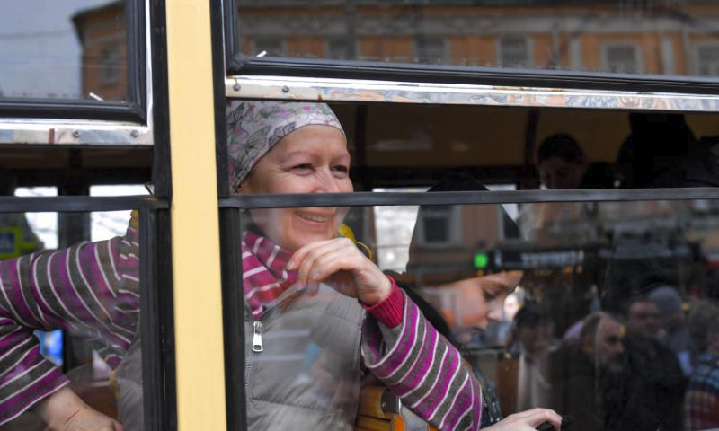 A woman looks on from a window of a tram after a parade of retro tramways in Moscow, Russia, on April 6, 2024. The parade of retro tramways was held on Saturday to mark the 125th anniversary of the opening of the first tram line in Moscow. (Photo by Alexander Zemlianichenko Jr/Xinhua)
