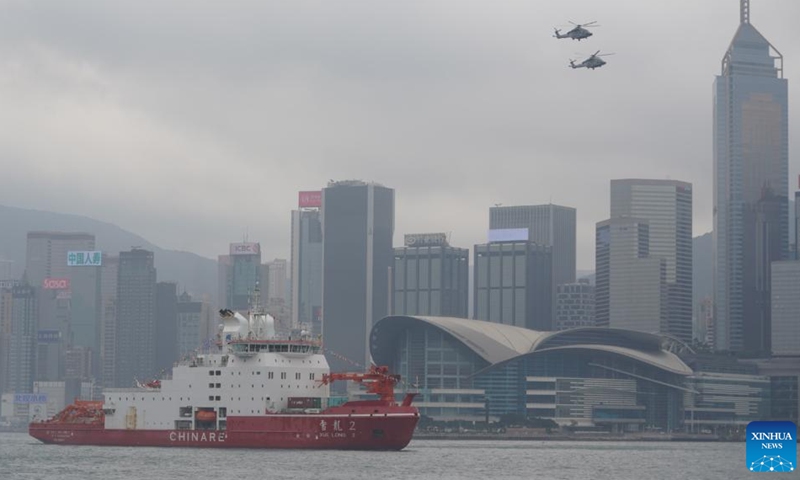 China's polar icebreaker Xuelong 2, or Snow Dragon 2, enters the Ocean Terminal in Tsim Sha Tsui, Hong Kong, south China, April 8, 2024. China's first domestically made polar icebreaker Xuelong 2, or Snow Dragon 2, arrived in Hong Kong for the very first time on Monday for a five-day visit. (Xinhua/Lui Siu Wai)

