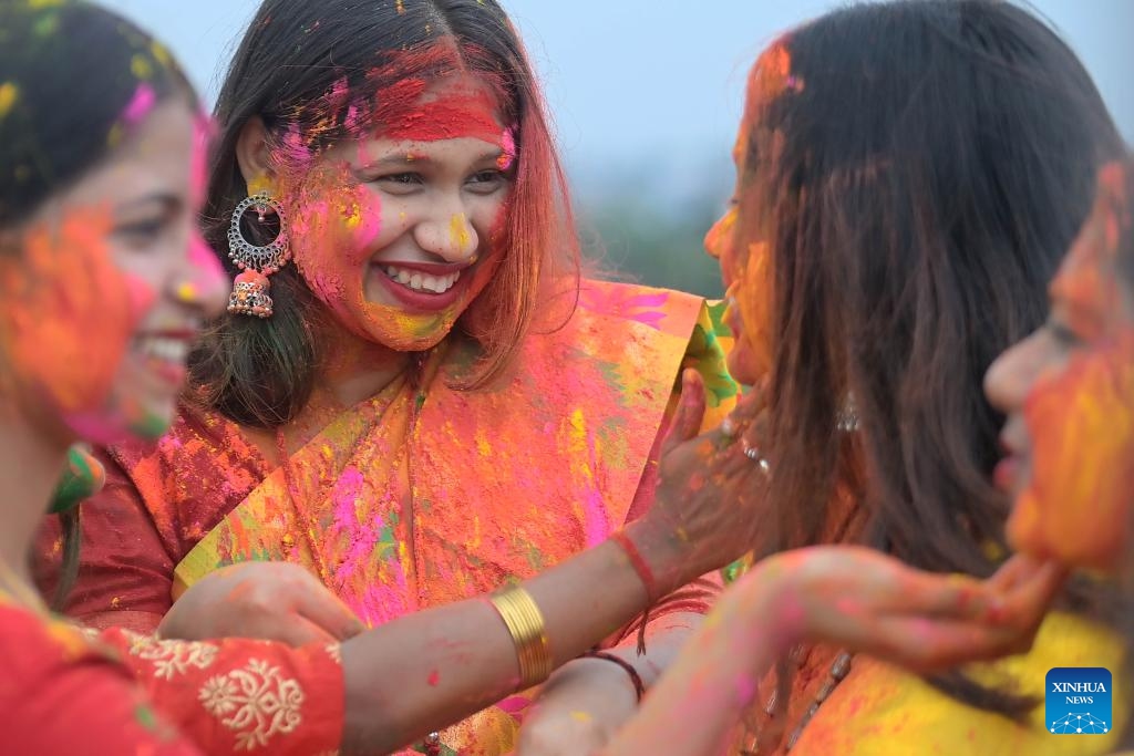 Women smear colored powder on each other's faces during the celebration to mark Holi, the spring festival of colors, in Agartala, the capital city of India's northeastern state of Tripura, March 24, 2024.(Photo: Xinhua)