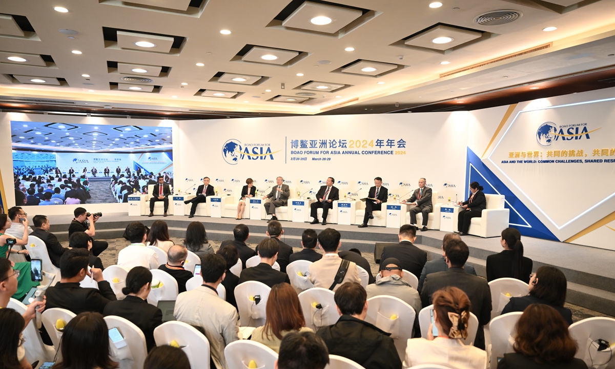 Participants take notes at a sub-forum of the Boao Forum for Asia 2024 annual conference titled 