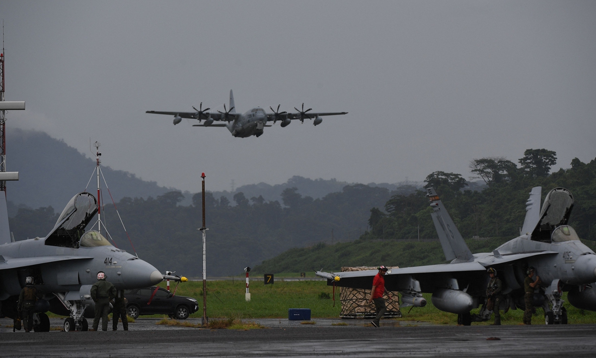 A US Air Force C-130 cargo plane comes in for a landing past US marines F/A-18 Hornet fighter jets during the semi-annual Philippine-US military exercise at the airport of the former US naval base in Manila, the Philippines, on July 13, 2023. Photo: VCG