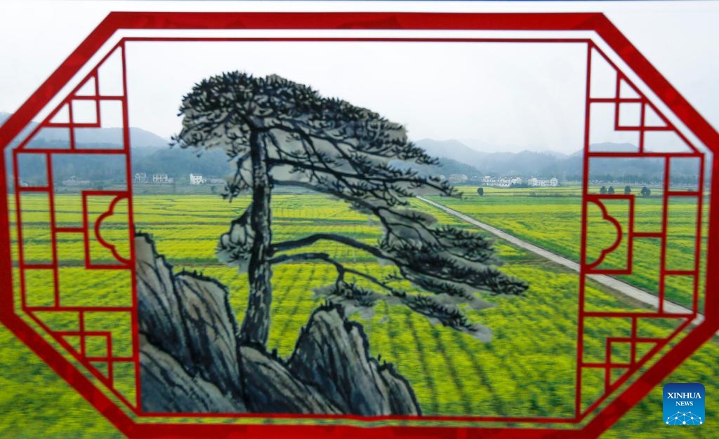 This photo taken on March 26, 2024 shows the scenery through a window of a bullet train running on the Chizhou-Huangshan high-speed railway during test operation in east China's Anhui Province. Connecting Chizhou Station and Yixian County East Station in Huangshan City, the Chizhou-Huangshan high-speed railway started test operation on Tuesday. With a total length of about 125 kilometers, the railway has a designed speed of 350 kilometers per hour.(Photo: Xinhua)