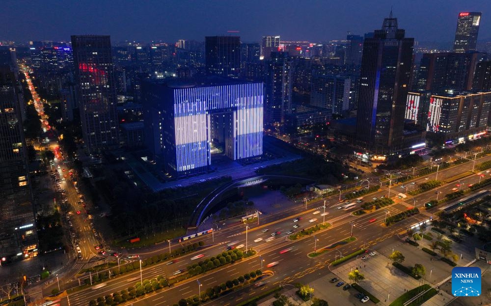An aerial drone photo taken on March 26, 2024 shows a building illuminated to celebrate the first anniversary of the establishment of diplomatic relations between China and Honduras, in Nanjing, east China's Jiangsu Province.(Photo: Xinhua)