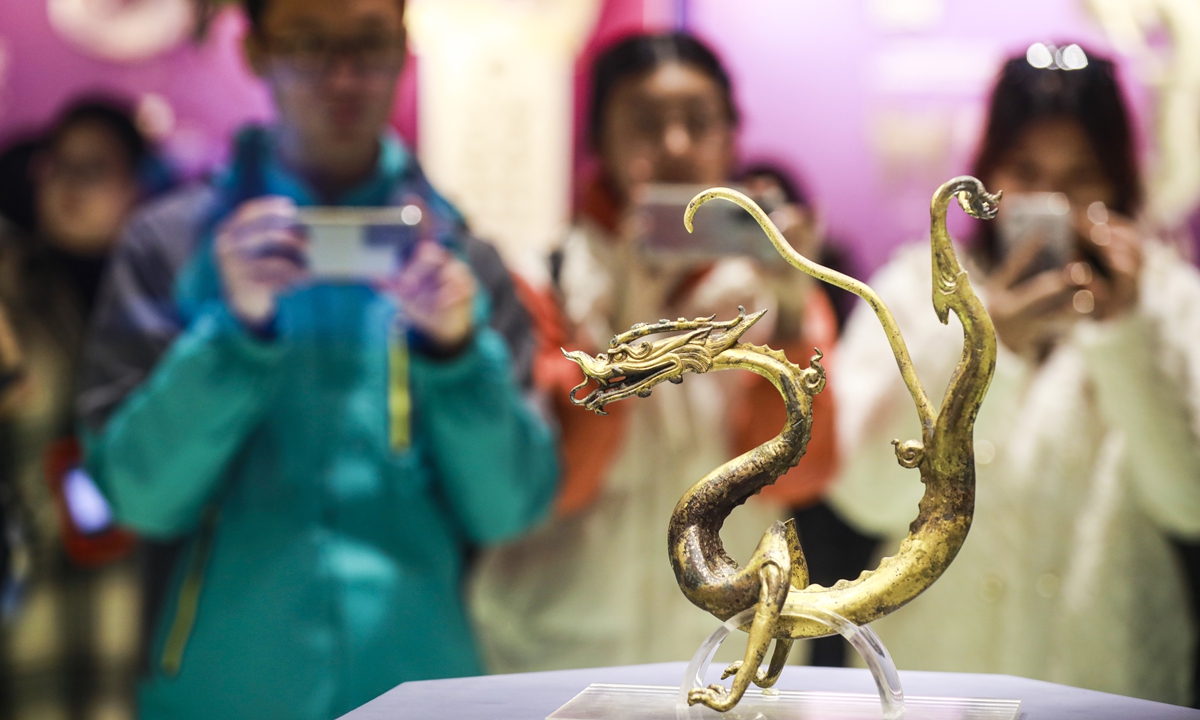 Visitors take photos of a bronze dragon in the Shaanxi History Museum in Xi’an, Northwest China’s Shaanxi Province. Photo: VCG