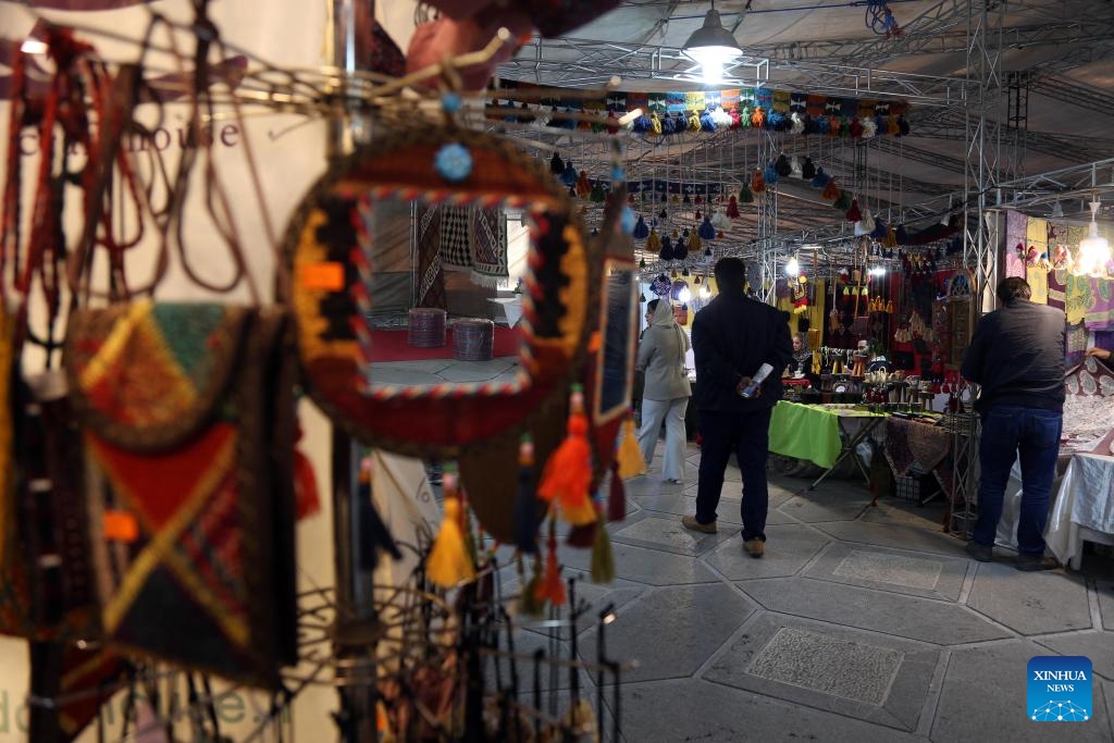 People visit a bazaar outside the Niavaran Palace in northern Tehran, capital of Iran, March 26, 2024. People visited the Niavaran Palace during the new year vacation of Nowruz, which falls on March 20 this year.(Photo: Xinhua)
