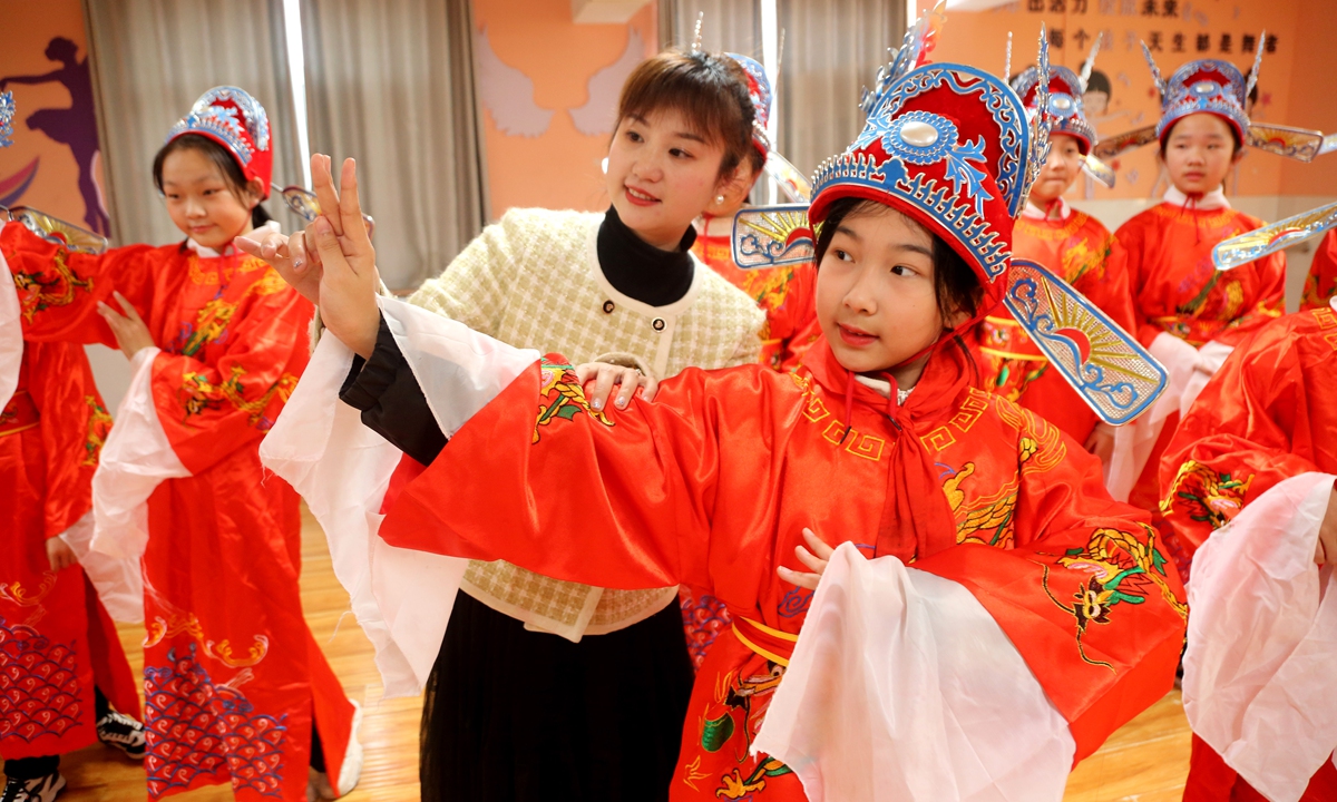 A teacher guides students in a traditional Chinese drama performance at an elementary school in Lianyungang, East China's Jiangsu Province on March 27, 2024. Photo: VCG
