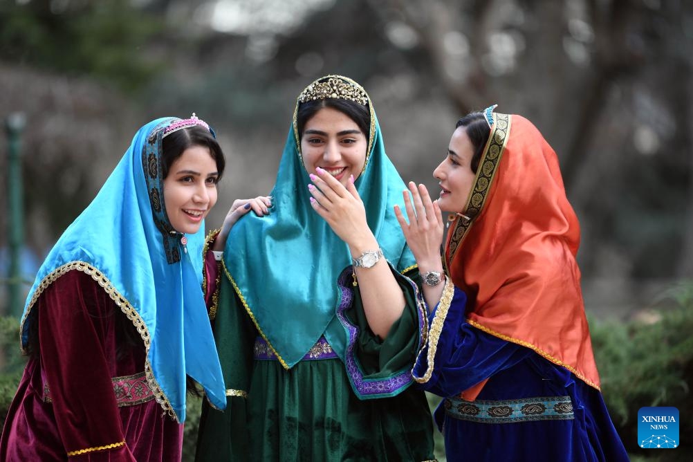 Girls talk outside the Niavaran Palace in northern Tehran, capital of Iran, March 26, 2024. People visited the Niavaran Palace during the new year vacation of Nowruz, which falls on March 20 this year.(Photo: Xinhua)