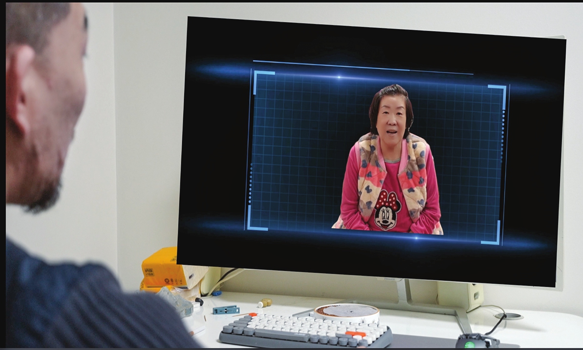 Zhu Rui interacts with his 