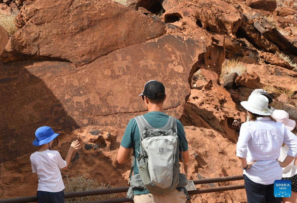 People visit the Twyfelfontein rock engraving site in Kunene Region, Namibia, March 26, 2024. Twyfelfontein is one of the largest and most concentrated sites of rock engravings in Africa to date. The site was recognized by UNESCO as Namibia's first World Heritage in 2007.(Photo: Xinhua)