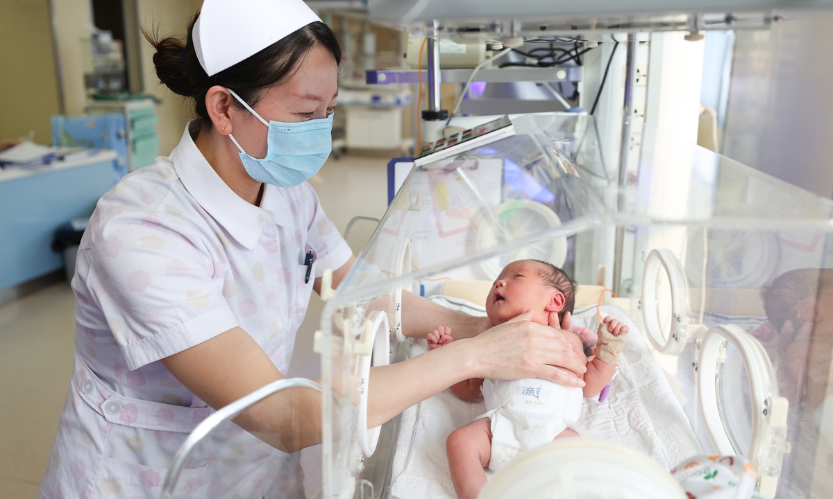 A medical staff member cares for a newborn at the neonatal care unit of a hospital in Lianyungang, East China's Jiangsu Province on January 1, 2024. Photo: VCG