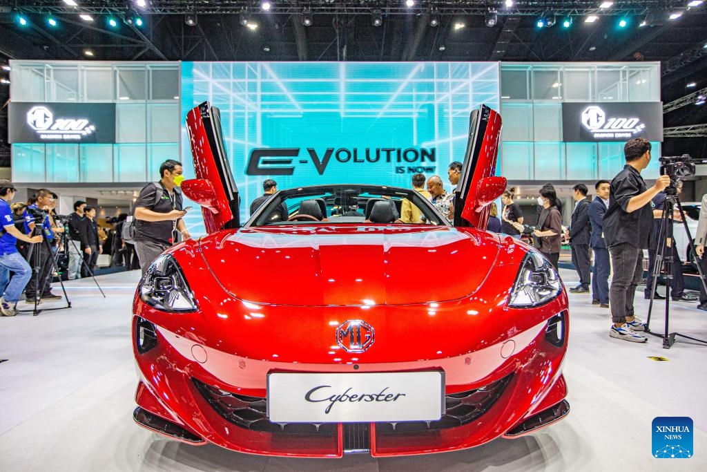 Visitors look at a MG Cyberster during the 45th Bangkok International Motor Show in Bangkok, Thailand, March 27, 2024. The 45th Bangkok International Motor Show kicked off here on Wednesday and will last until April 7.(Photo: Xinhua)