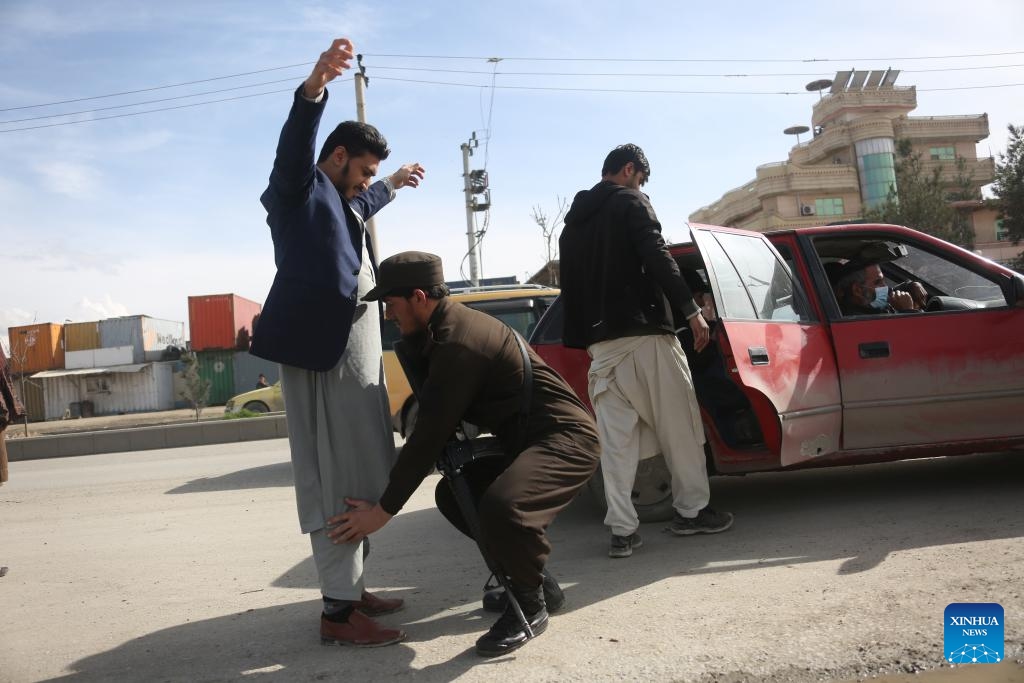 An Afghan security force member makes a body search at a checkpoint in Kabul, the capital of Afghanistan, March 28, 2024. The Afghan police have arrested 12,540 criminal suspects over the past six months across the country, the Ministry of Interior Affairs said Thursday. (Photo: Xinhua)