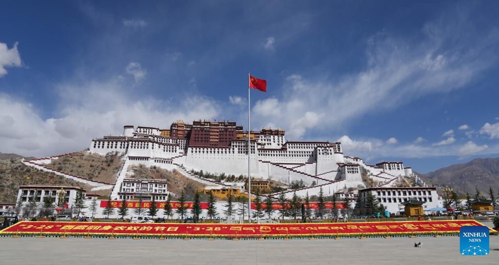 The national flag of China is seen on the square in front of the Potala Palace on the Serfs' Emancipation Day in Lhasa, capital of southwest China's Xizang Autonomous Region, March 28, 2024. On March 28, 1959, people in Xizang launched the democratic reform, freeing a million serfs. In 2009, the regional legislature announced March 28 as the day to commemorate the emancipation of the one million serfs.(Photo: Xinhua)