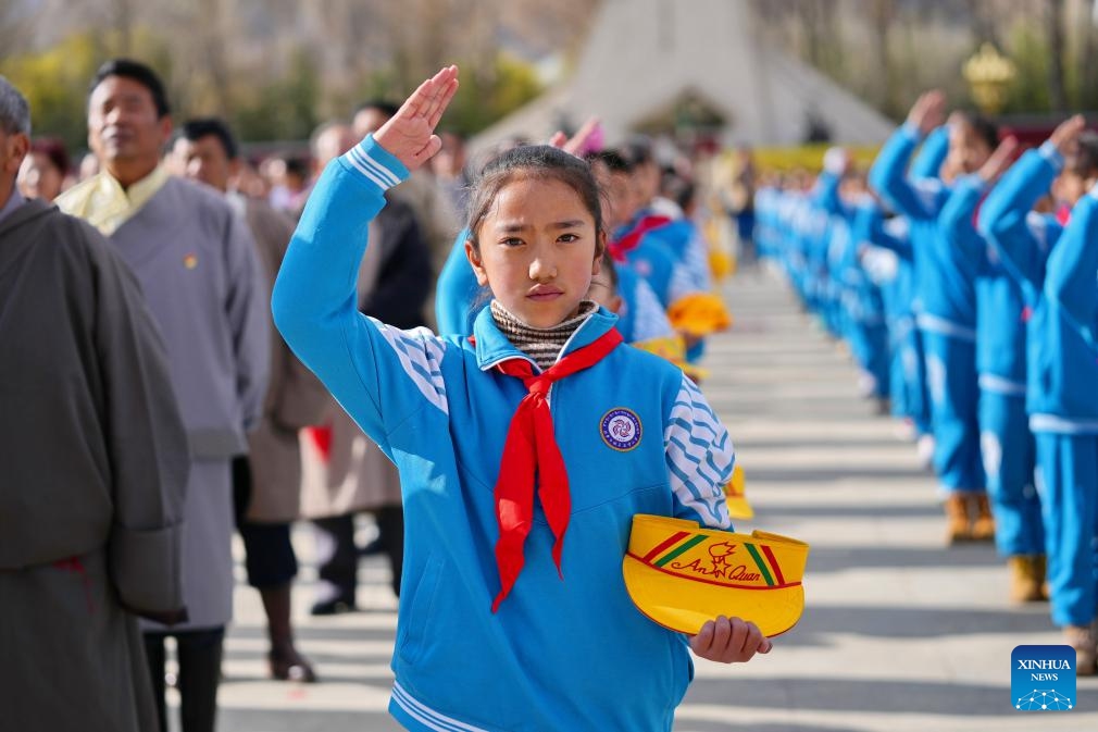 A young pioneer salutes at a flag-raising ceremony to celebrate the Serfs' Emancipation Day at the square in front of the Potala Palace in Lhasa, capital of southwest China's Xizang Autonomous Region, March 28, 2024. On March 28, 1959, people in Xizang launched the democratic reform, freeing a million serfs. In 2009, the regional legislature announced March 28 as the day to commemorate the emancipation of the one million serfs.(Photo: Xinhua)