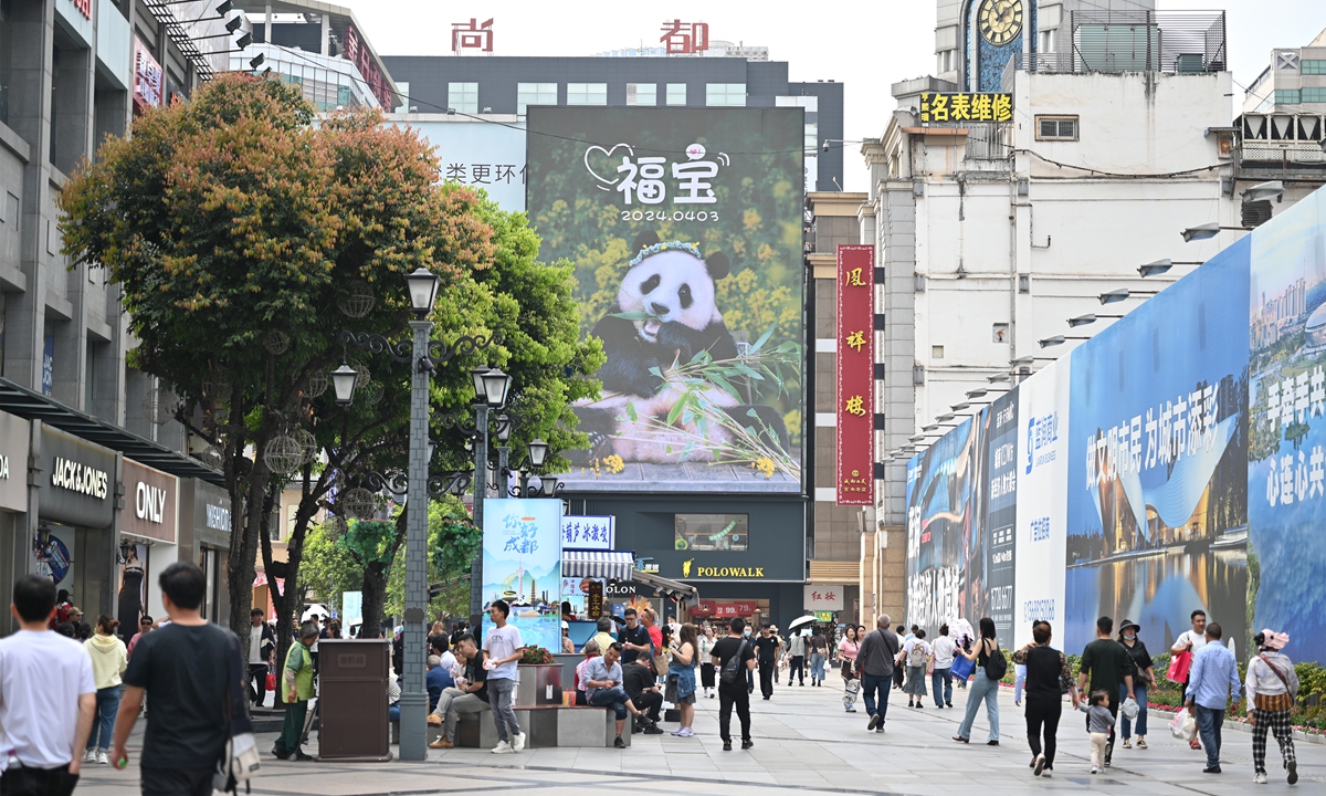 A poster of Giant panda Fu Bao is on display in Chunxi Road, Chengdu, Southwest China's Sichuan Province on April 2, 2024. Fu Bao, the first giant panda born in South Korea through natural breeding in 2020, is scheduled to return to China on April 3. Photo: VCG