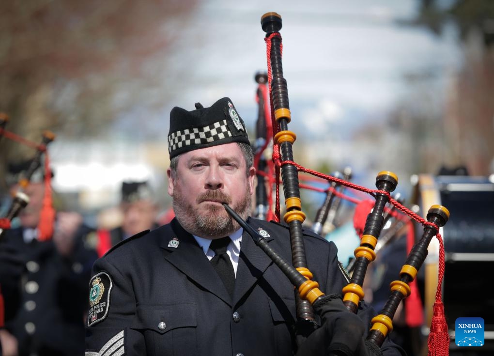 A member of the police pipe band performs during the 2024 Easter Parade at Ladner Village in Delta, British Columbia, Canada, on March 31, 2024.(Photo: Xinhua)