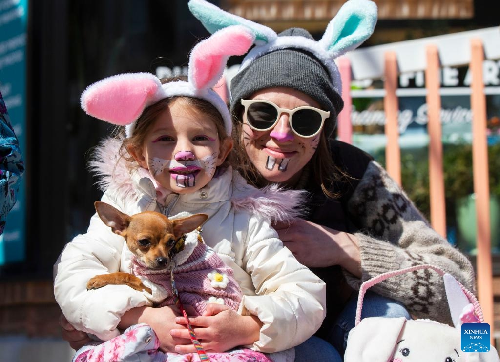 A mother and her daughter wearing bunny decorations and makeup are seen during the 2024 Toronto Beaches Lions Easter Parade in Toronto, Canada, on March 31, 2024.(Photo: Xinhua)