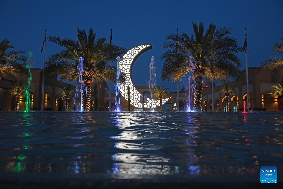 An illuminated steel sculpture of a crescent is seen at Al-Kout Mall in Ahmadi Governorate, Kuwait, March 31, 2024. Kuwait set the Guinness World Record for the world's largest illuminated steel sculpture of a crescent on Sunday. The crescent's height is measured 15 meters and the feat was approved by the Guinness Book of World Records.(Photo: Xinhua)