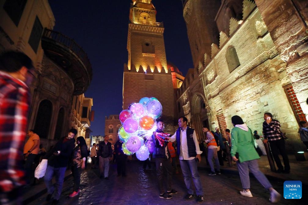 A man sells light-up balloons on Muizz Street during Ramadan in Cairo, Egypt, on April 1, 2024.(Photo: Xinhua)