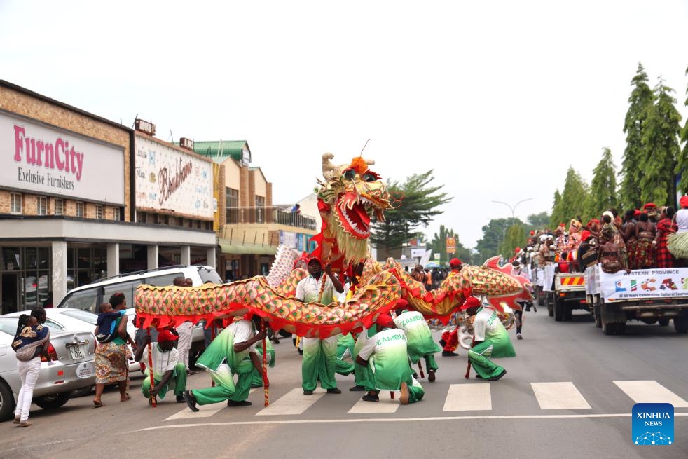 People watch a dragon dance during the 2024 Livingstone International Culture and Arts Festival in Livingstone, Zambia, March 30, 2024. The event was held here from March 28 to 30.(Photo: Xinhua)