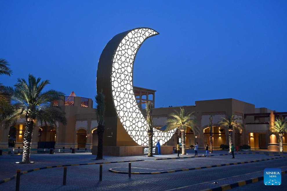 An illuminated steel sculpture of a crescent is seen at Al-Kout Mall in Ahmadi Governorate, Kuwait, March 31, 2024. Kuwait set the Guinness World Record for the world's largest illuminated steel sculpture of a crescent on Sunday. The crescent's height is measured 15 meters and the feat was approved by the Guinness Book of World Records.(Photo: Xinhua)