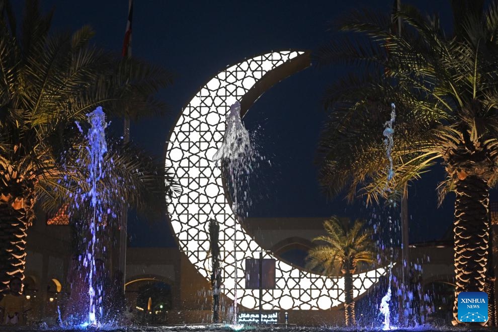 An illuminated steel sculpture of a crescent is seen at Al-Kout Mall in Ahmadi Governorate, Kuwait, March 31, 2024. Kuwait set the Guinness World Record for the world's largest illuminated steel sculpture of a crescent on Sunday. The crescent's height is measured 15 meters and the feat was approved by the Guinness Book of World Records.(Photo: Xinhua)