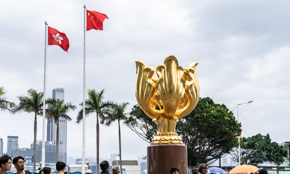 Hong Kong residents and tourists visit the Golden Bauhinia Square on March 23, 2024. Photo: VCG