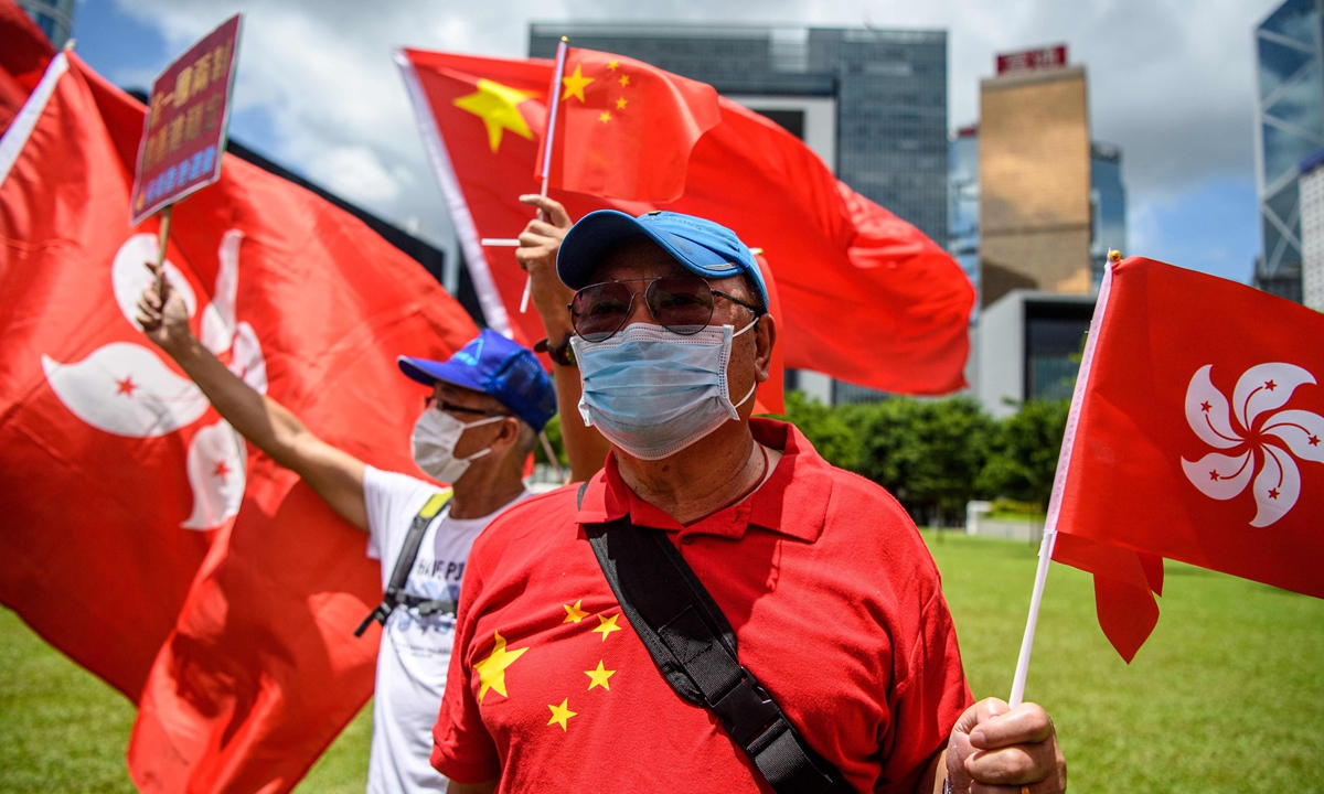 Hong Kong residents gather on June 30, 2020, to express support to the decision of Chinese lawmakers to adopt the Law on Safeguarding National Security in Hong Kong. Photo: VCG