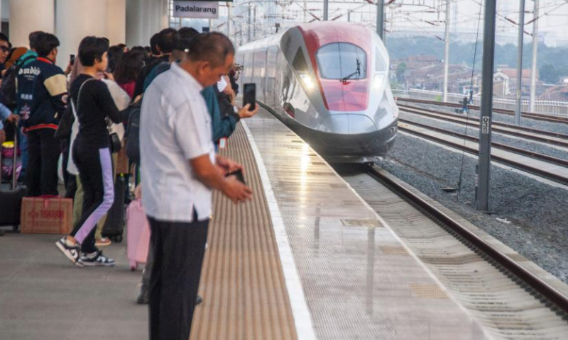 Passengers board a high-speed electrical multiple unit (EMU) train at the Jakarta-Bandung High-Speed Railway's Padalarang Station in Padalarang, Indonesia, April 7, 2024. The holy month of Ramadan and the celebration of Islamic post-fasting festivity Eid-al-Fitr have been associated with a homecoming tradition, locally known as mudik, for many people in Indonesia with the world's largest Muslim population. (Photo by Septianjar Muharam/Xinhua)