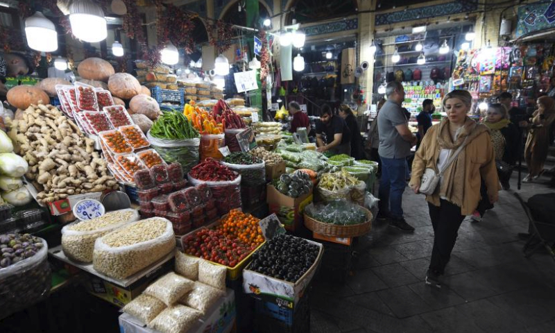 People buy goods ahead of Eid al-Fitr at a bazzar in Tehran, Iran, April 7, 2024. (Xinhua/Shadati)