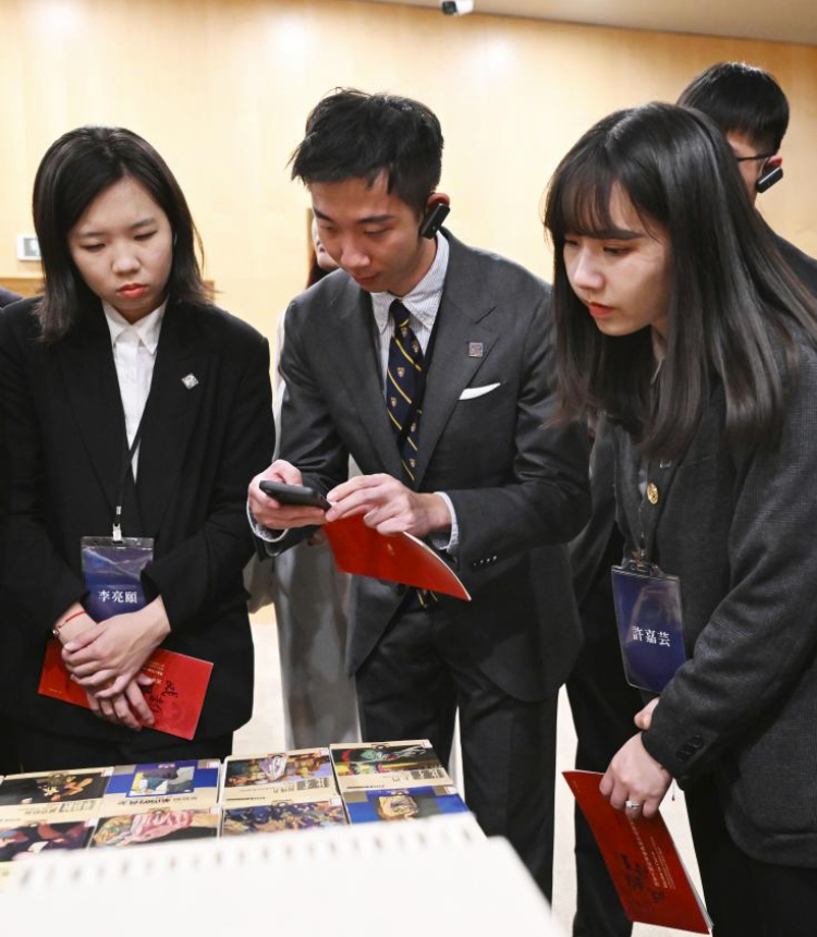 Members of a delegation of young people from Taiwan led by Ma Ying-jeou, former chairman of the Chinese Kuomintang party, visit the resource center of the National Center for the Performing Arts (NCPA) in Beijing, capital of China, April 7, 2024. Ma and the Taiwan youth delegation led by him visited the NCPA on Sunday. (Xinhua/Chen Yehua)
