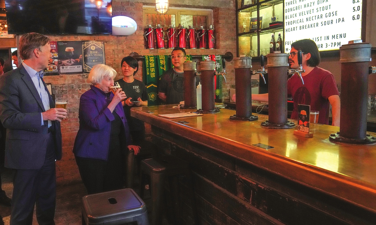US Treasury Secretary Janet Yellen (second left) and US Ambassador to China Nicholas Burns (left) sample beer at the Jing-A brewery in Beijing on April 8, 2024. Photo: VCG