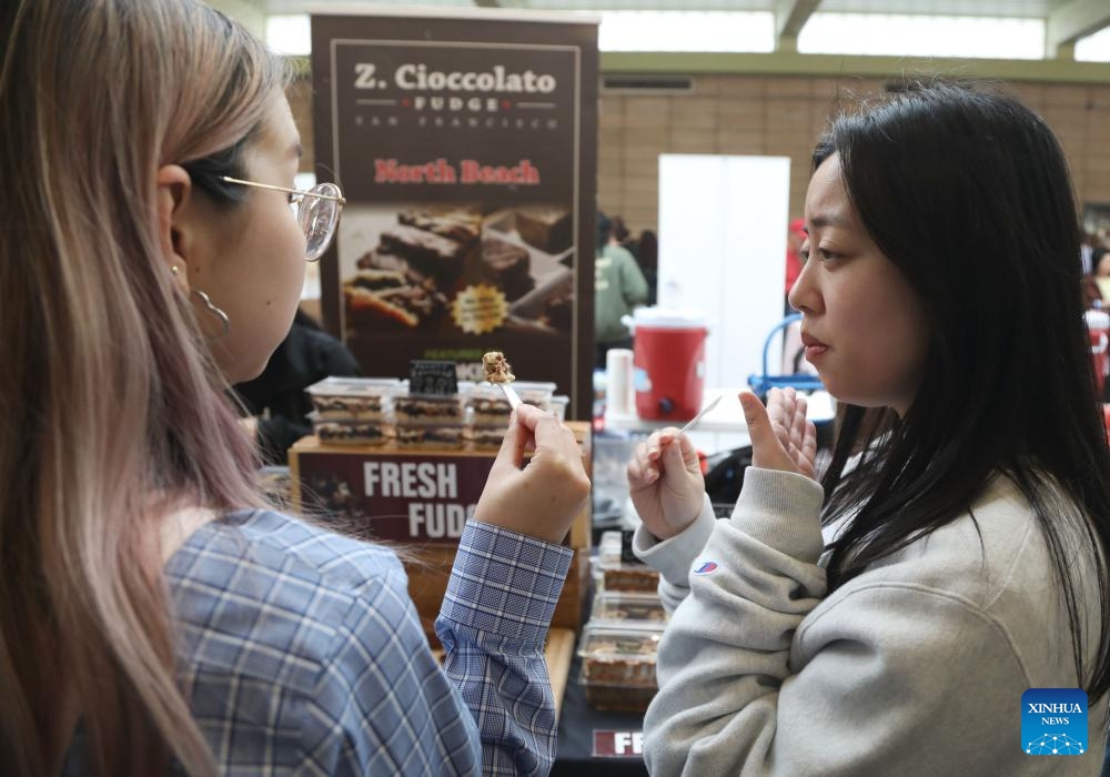 People taste chocolate at the 16th Annual San Francisco International Chocolate Salon in San Francisco, the United States, April 7, 2024.(Photo: Xinhua)