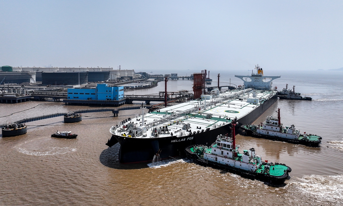 The Greek-flagged tanker Hellas Fos berths at a crude oil terminal at the Ningbo Zhoushan Port in East China's Zhejiang Province on April 9, 2024. To ensure the region's stable oil supply, the port operates customs clearance 24/7, aiming to eliminate waiting times for tankers. Photo: VCG