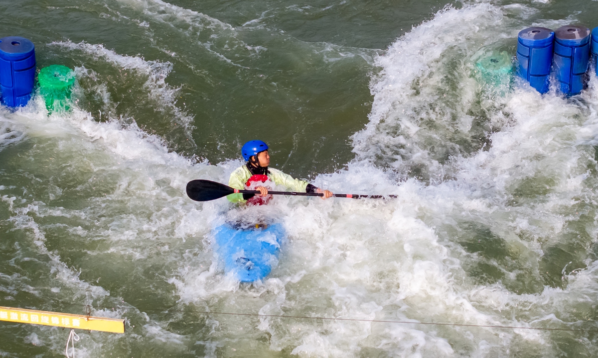 A young athlete trains at the National Canoe Slalom Training Base in Yiyang, Central China's Henan Province, on April 9, 2024. The 2024 National Canoe Slalom Youth Championships will be held there from May 2 to 5. Photo: VCG