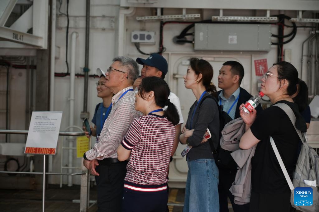 Citizens watch a documentary as they visit the polar icebreaker Xuelong 2 in Hong Kong, south China, April 9, 2024. China's first domestically made icebreaker Xuelong 2 on Monday arrived in the country's Hong Kong Special Administrative Region (HKSAR) for a five-day visit. Xuelong 2, which came to Hong Kong for the very first time, entered the Ocean Terminal in Tsim Sha Tsui on Monday morning after completing their latest Antarctic expedition.(Photo: Xinhua)