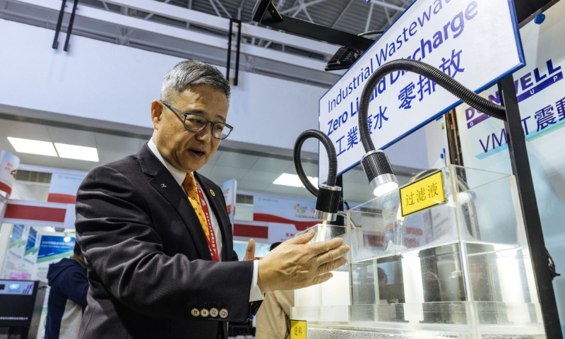 Professor Daniel Cheng Man-chung, president of the Hong Kong Environmental Industry Association, introduces his company's water treatment technology at the China International Environmental Protection Exhibition and Conference in Beijing on April 10, 2024. Photo: Li Hao/GT