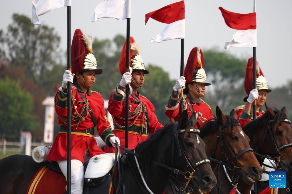 Nepal Army soldiers perform horse riding in celebration of Ghode Jatra in Kathmandu, Nepal, April 8, 2024. The Nepal Army organized horse racing, acrobatics performance and other activities to mark the traditional Ghode Jatra, or horse racing festival, on Monday.(Photo: Xinhua)