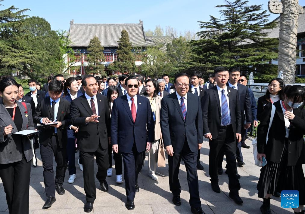 Hao Ping, secretary of the Communist Party of China (CPC) Peking University Committee, and Gong Qihuang, president of Peking University, accompany Ma Ying-jeou, former chairman of the Chinese Kuomintang party, and members of a Taiwan youth delegation, to visit the campus of Peking University in Beijing, capital of China, April 9, 2024. Ma and a Taiwan youth delegation led by him visited the Peking University on Tuesday.(Photo: Xinhua)