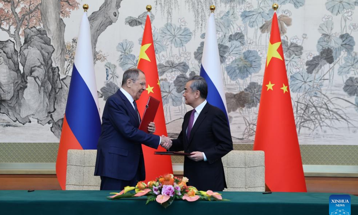 Chinese Foreign Minister Wang Yi, also a member of the Political Bureau of the Communist Party of China Central Committee, and Minister of Foreign Affairs of the Russian Federation Sergey Lavrov sign the plan on consultation between the two foreign ministries for 2024 after their talks in Beijing, capital of China, April 9, 2024. Photo: Xinhua