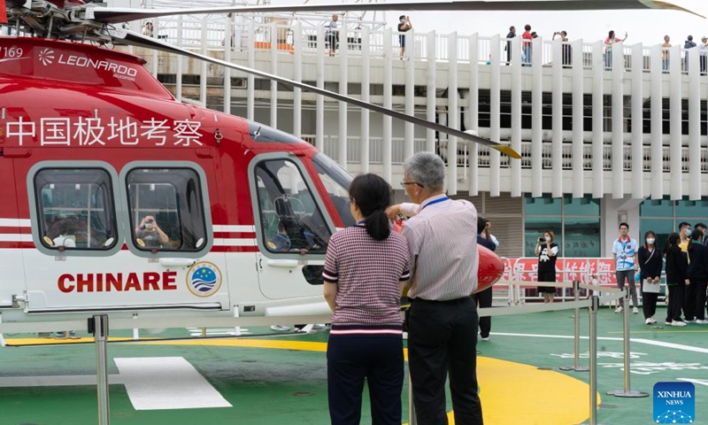 Citizens are seen on the deck of the polar icebreaker Xuelong 2 in Hong Kong, south China, April 9, 2024. China's first domestically made icebreaker Xuelong 2 on Monday arrived in the country's Hong Kong Special Administrative Region (HKSAR) for a five-day visit. Xuelong 2, which came to Hong Kong for the very first time, entered the Ocean Terminal in Tsim Sha Tsui on Monday morning after completing their latest Antarctic expedition.(Photo: Xinhua)
