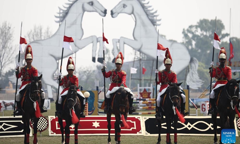 Nepal Army soldiers perform horse riding in celebration of Ghode Jatra in Kathmandu, Nepal, April 8, 2024. The Nepal Army organized horse racing, acrobatics performance and other activities to mark the traditional Ghode Jatra, or horse racing festival, on Monday.(Photo: Xinhua)